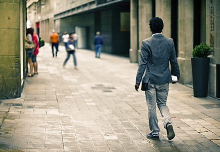Man Wearing Gray Suit Jacket While on Pathway thumbnail