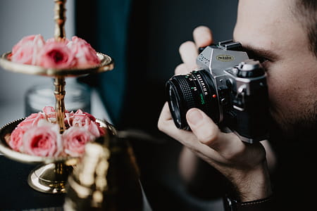 Young man taking photos thumbnail