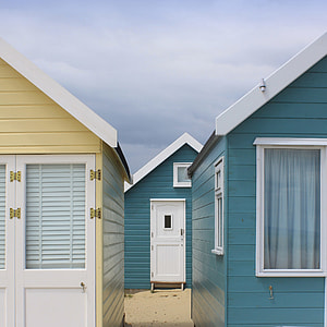 two houses side by side in front of another one thumbnail