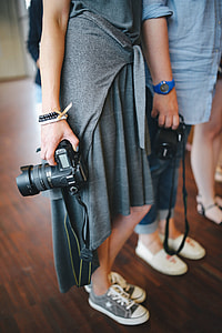 People with cameras at an exhibition thumbnail
