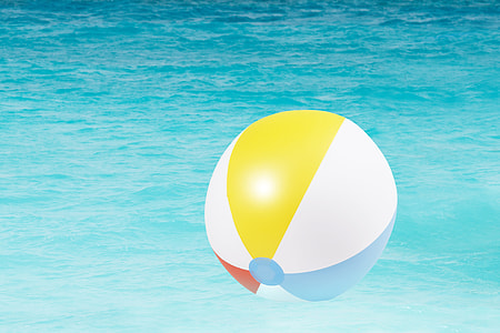 white and multicolored ball floater on body of water thumbnail