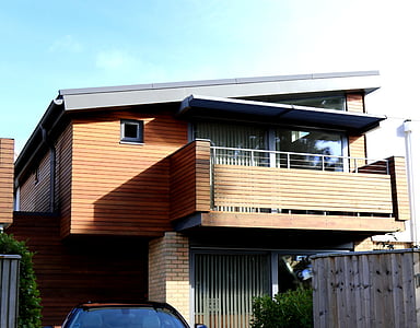 low angle of brown wooden 2-storey house thumbnail