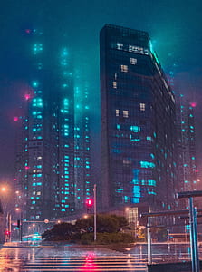turned on lights in glass high-rise building thumbnail