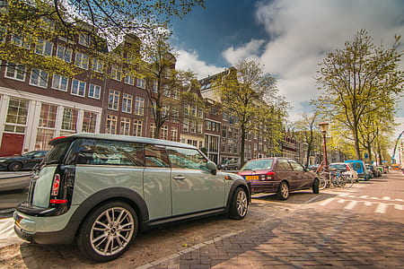 assorted-color cars parked in street thumbnail