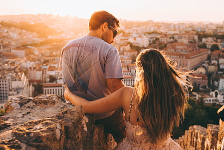 man and woman on rocks during daytime thumbnail