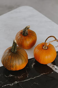 Orange halloween pumpkins on marble thumbnail