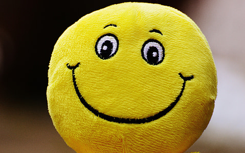 selective focus photography of smiley emoji throw pillow thumbnail
