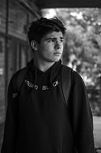 Man Wearing Hoodie Grayscale Photo thumbnail