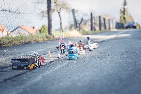 box and bottle on gray concrete road thumbnail