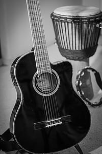 cutaway acoustic guitar and djembe thumbnail