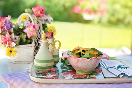 pink bowl filled with salad on tray beside table napkin thumbnail