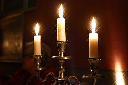 lighted candles on candle holder thumbnail
