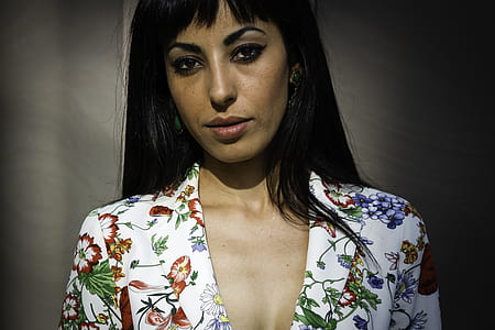 woman wearing white and red floral top thumbnail