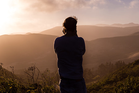 photography of a man in the top of mountain during sunset thumbnail