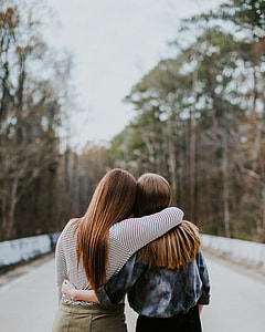 shallow focus of two woman back view thumbnail