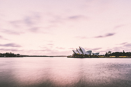 Sydney Opera House under cloudy sky during daytime thumbnail