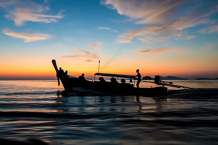 silhouette of people on boat thumbnail
