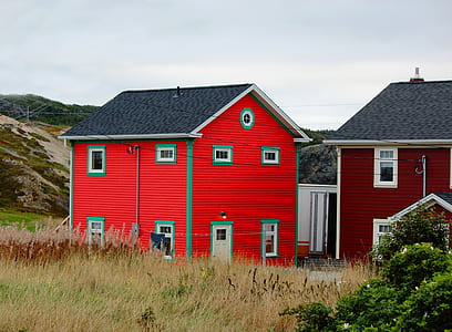 red wooden 2-storey house beside wheat field thumbnail