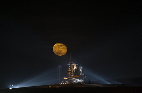 full moon over building thumbnail