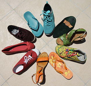 unpaired shoes lot during daytime thumbnail
