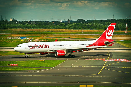 white and red Airberlin plane parked thumbnail