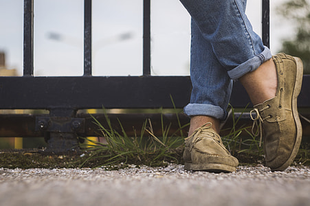 person showing pair of brown loafers step beside rails thumbnail