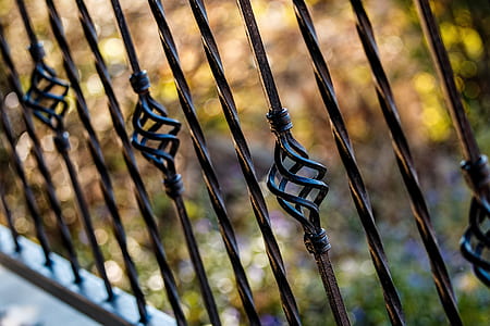 selective focus photography of black metal railings thumbnail