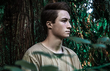 Man Wearing Brown Shirt Near Tree thumbnail