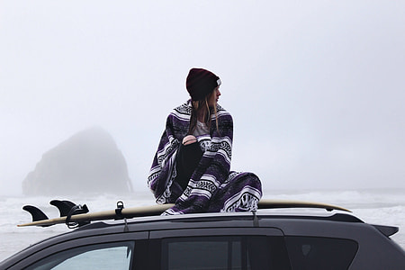 woman sitting on top of vehicle thumbnail
