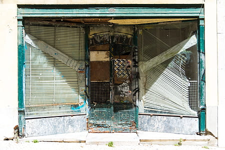 closed green metal door thumbnail