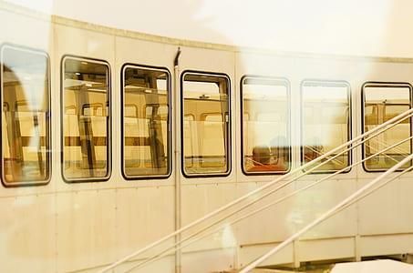 person inside white train at daytime thumbnail
