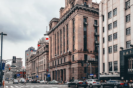 cars on road near buildings thumbnail