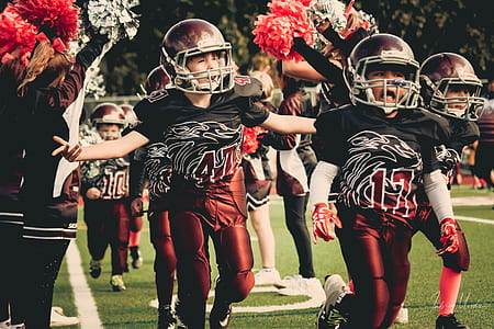 Children in White and Red Football Outfit thumbnail