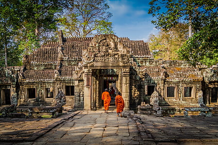 monks walking through the temple during daytime thumbnail