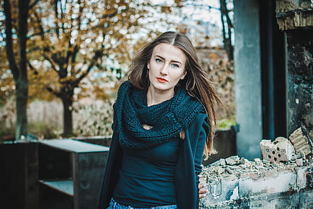 shallow focus photography of woman in black top posing for photo thumbnail