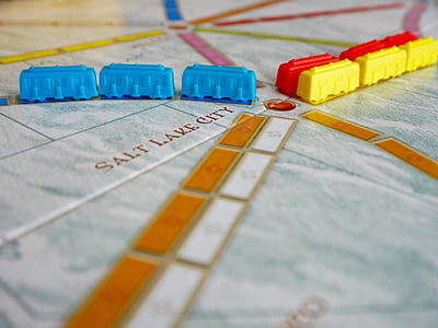 closeup photo of three yellow, red, and blue plastic train toys thumbnail