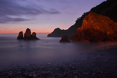 stone formation on body of water thumbnail