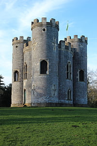 gray concrete castle surrounded by lawn thumbnail