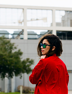 woman wearing black framed Wayfarer sunglasses and red long-sleeved shirt thumbnail