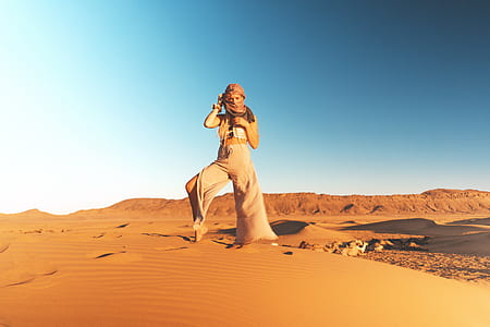 woman standing desert thumbnail