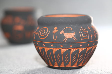 selective focus photo of gray and orange pot thumbnail