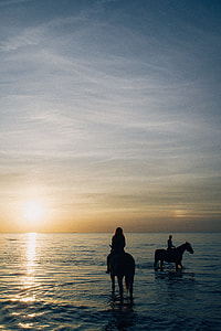 Two girls riding horses thumbnail