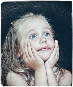 girl wearing white top holding face facing right direction thumbnail