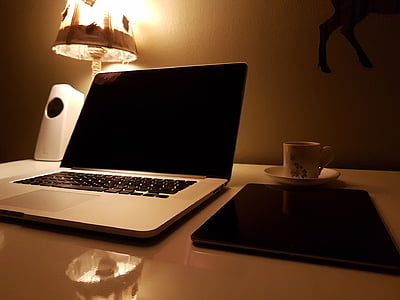 MacBook Pro near ceramic teacup thumbnail
