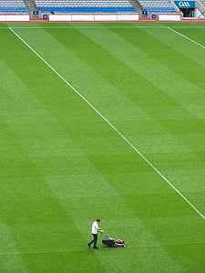 man cleaning football field thumbnail