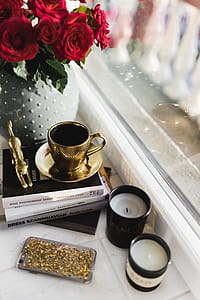 Gold cup of coffee and red roses bouqet thumbnail