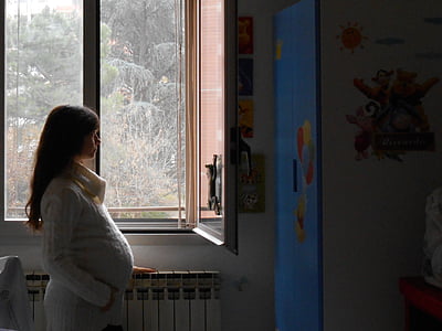 woman standing in near window thumbnail