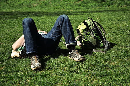 person on green grass field during daytime thumbnail
