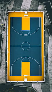 yellow and green basketball court high-angle photo thumbnail