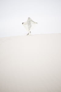 woman in white dress on desert thumbnail